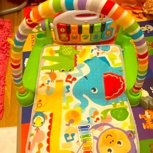 Fisher pricer deluxe kick & play  piano gym . Brand new used a couple of times